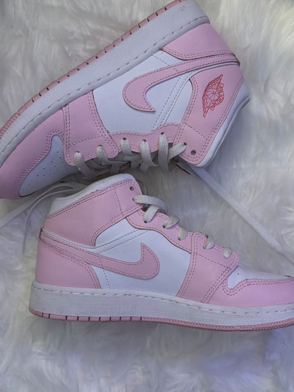 Pink and White High Top Nike Jordans